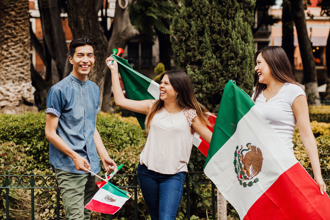 Viva Mexico, mexican guys with flag of Mexico in independence day in Mexico city